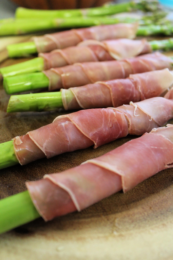 This Prosciutto Wrapped Asparagus recipe is super easy to make and is a yummy and flavorful addition to any meal. Learn how to make it!