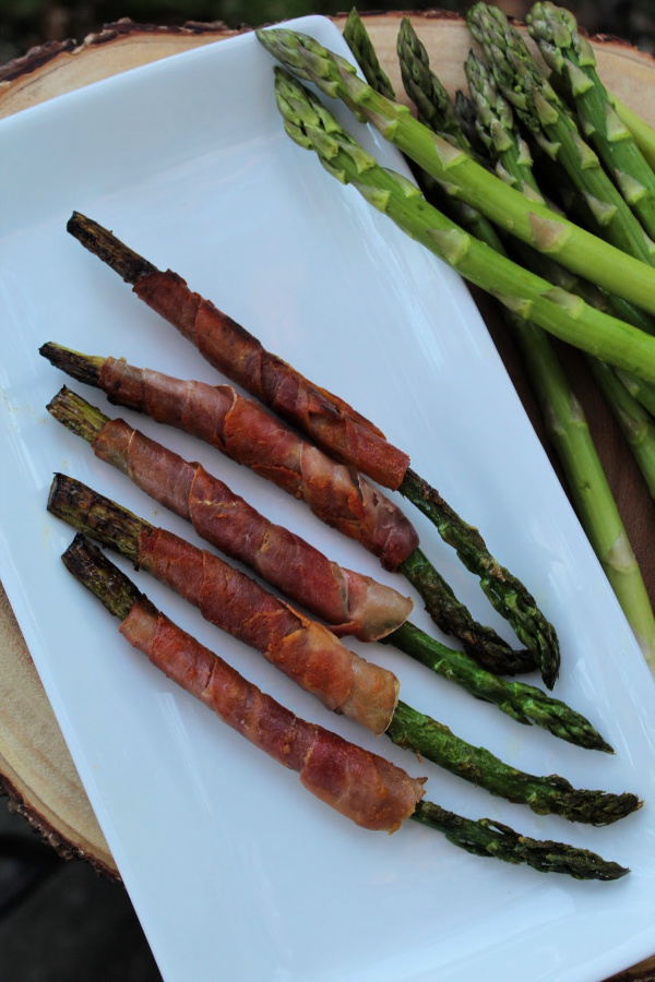 This Prosciutto Wrapped Asparagus recipe is super easy to make and is a yummy and flavorful addition to any meal. Learn how to make it!