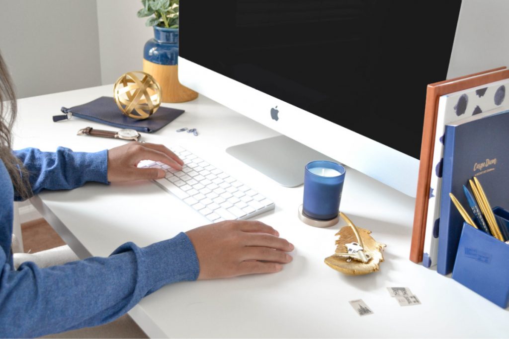 woman at desk working remotely.