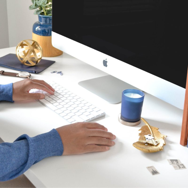 woman at desk working remotely.